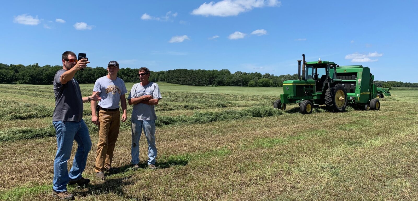 baling hay with millennial farmer